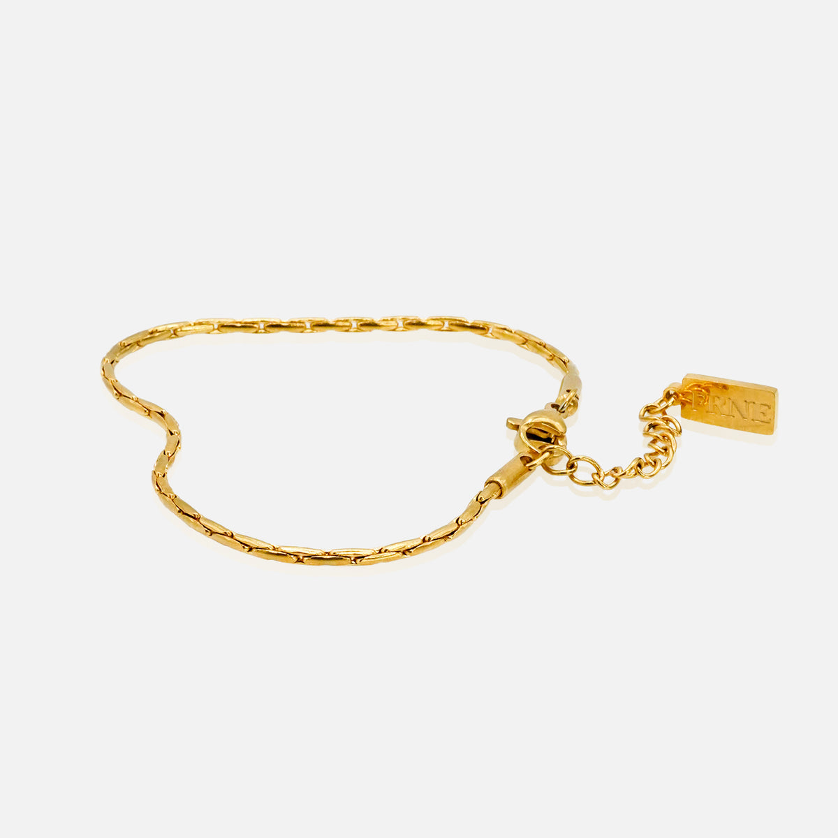 Gold refined link chain bracelet with extension chain on white background
