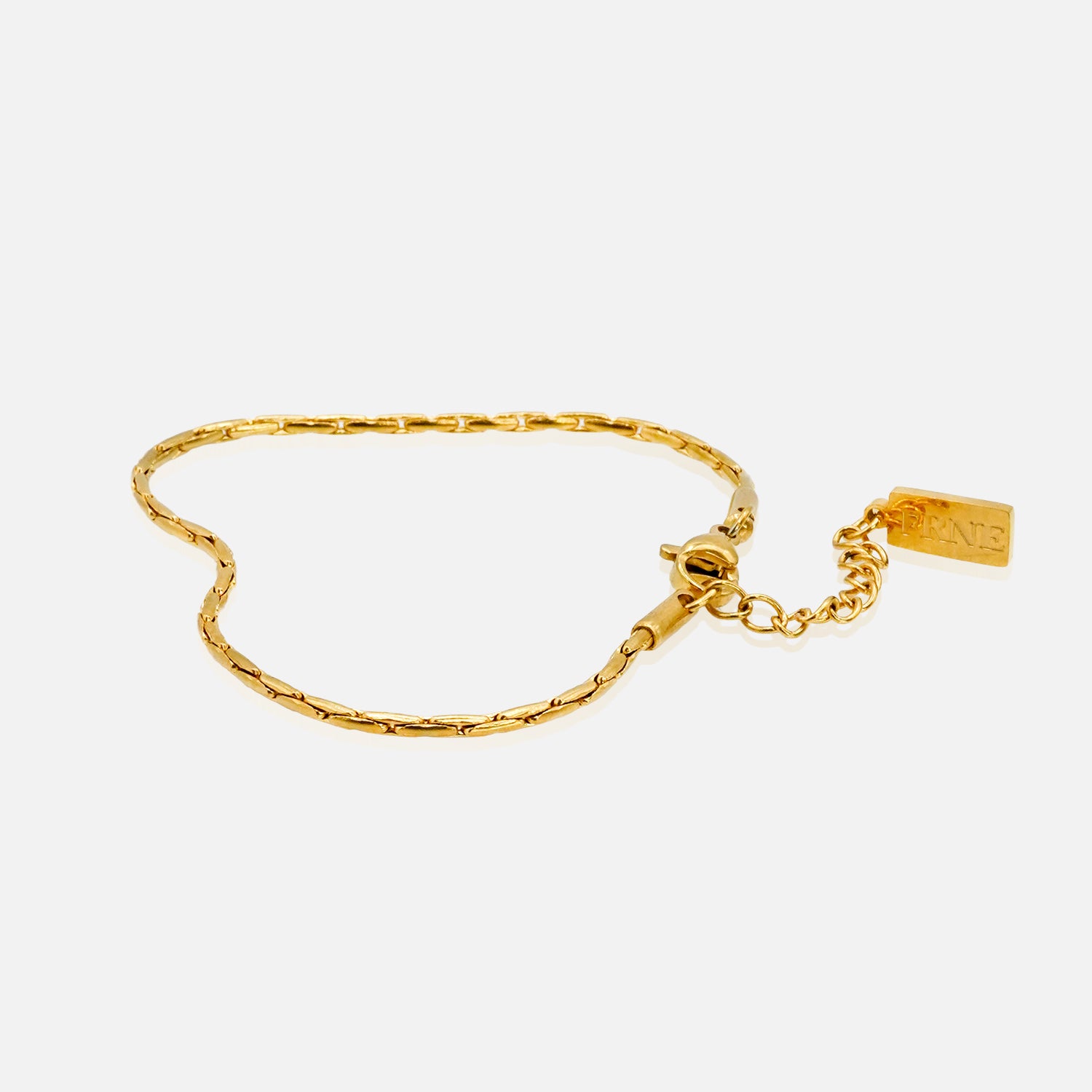 Gold refined link chain bracelet with extension chain on white background