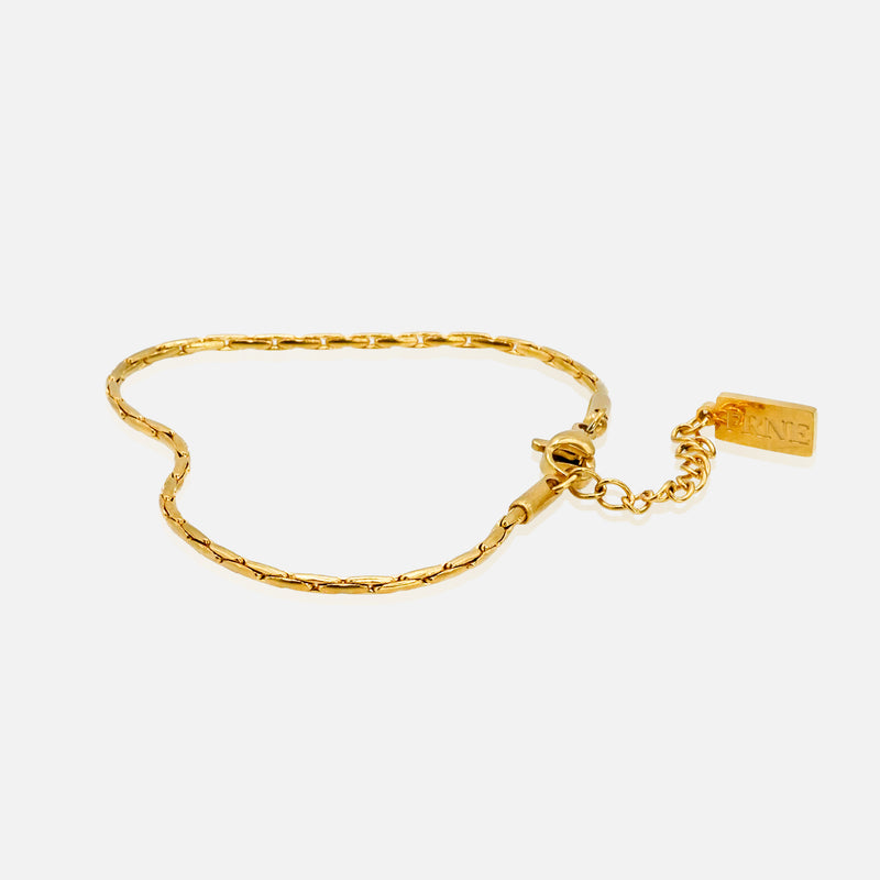 Gold refined link chain bracelet with extension chain on white background