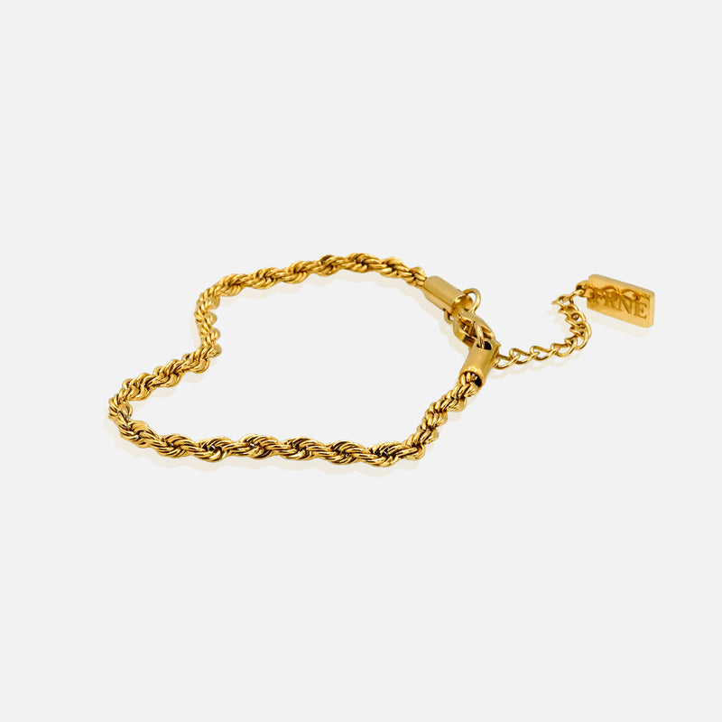 Gold rope bracelet with extension chain on clean white background