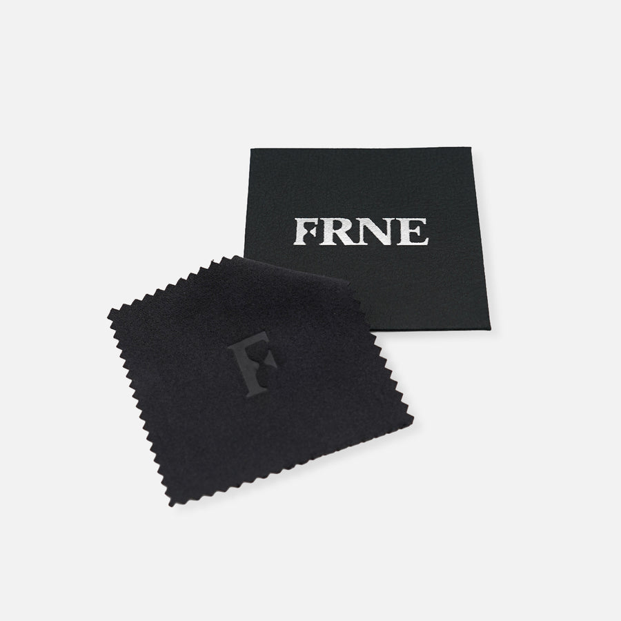 Premium jewellery cleaning cloth by FRNE with branded card for maintaining silver bracelet on white background