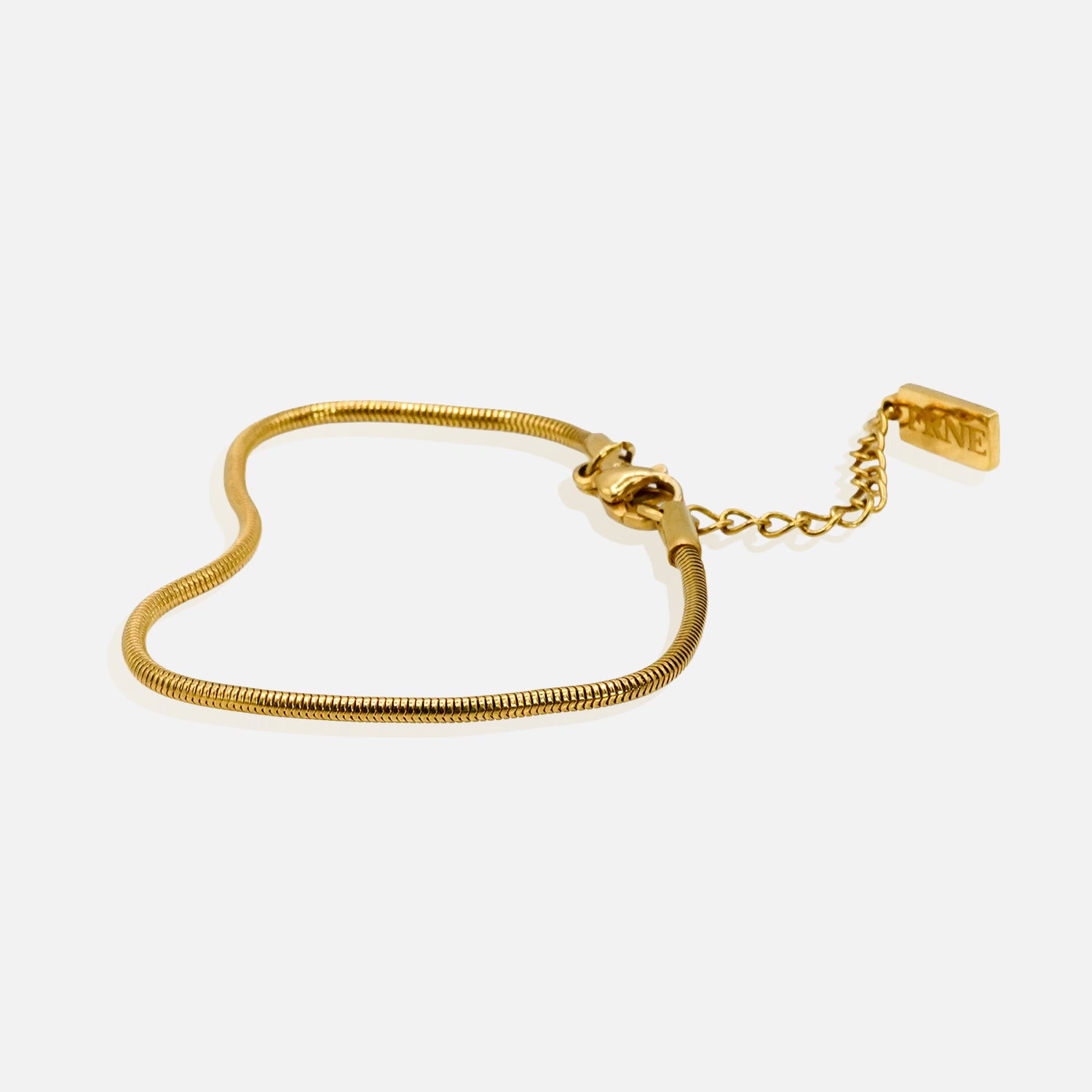 Premium gold snake chain bracelet by FRNE with minimalist design and extension chain on white background