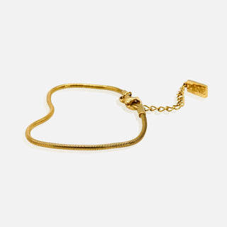 Premium gold snake chain bracelet by FRNE with minimalist design and extension chain on white background