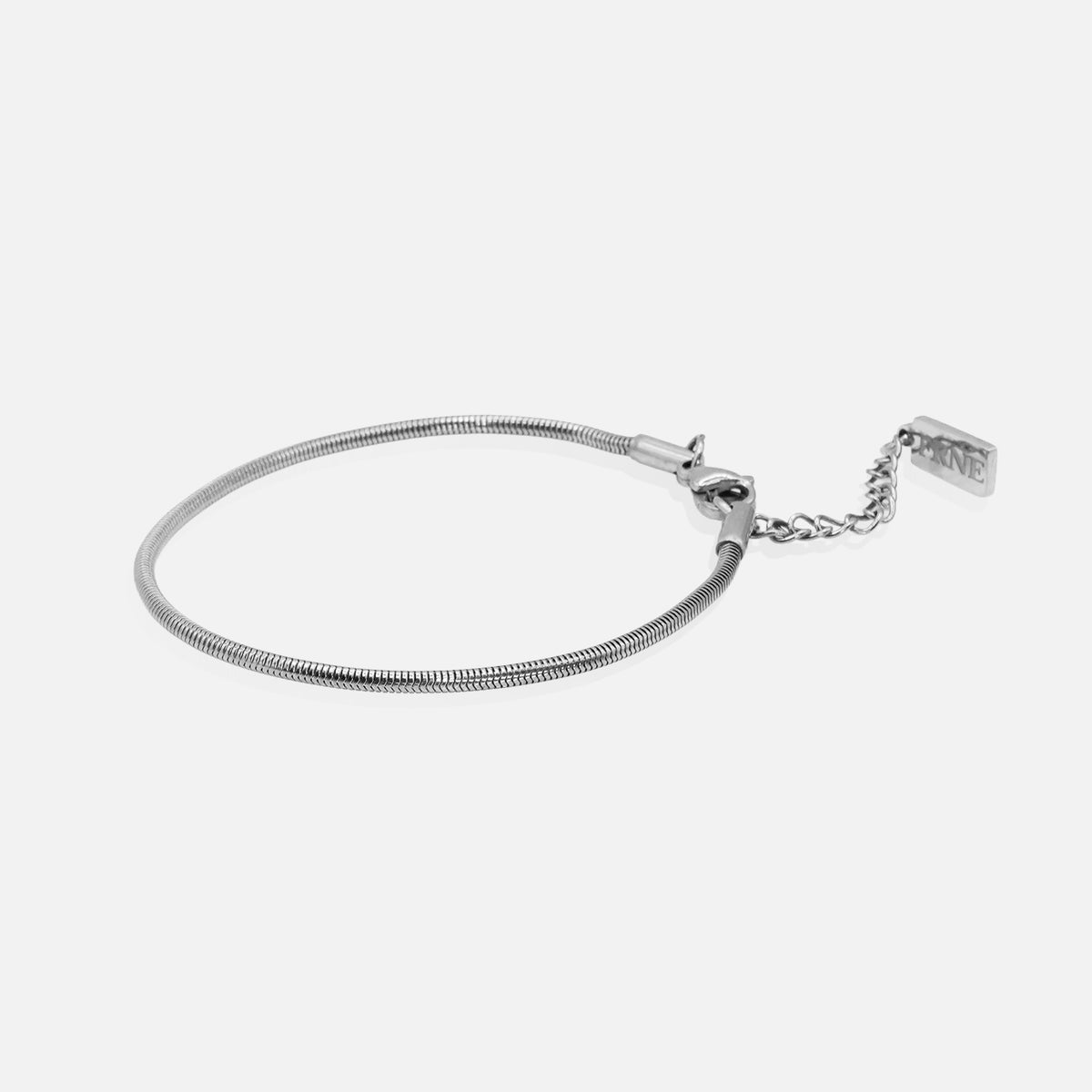 Premium silver snake chain bracelet by FRNE with minimalist design and extension chain on white background