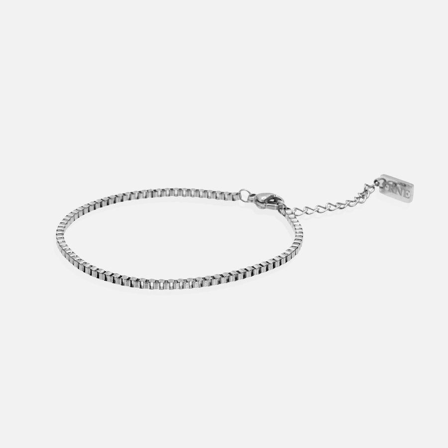 Minimal silver box chain bracelet with extension chain on white background