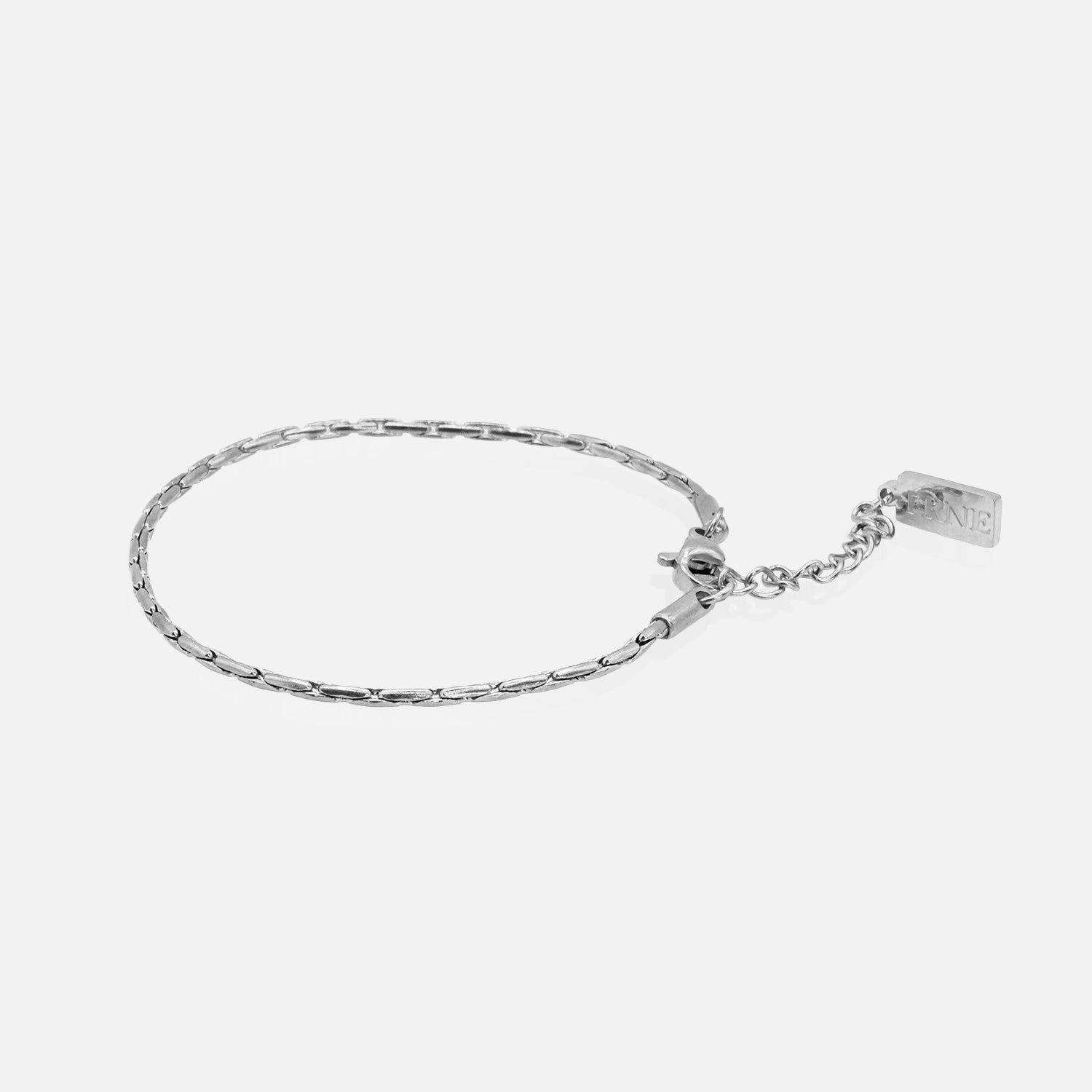 Silver round snake chain bracelet with extension chain on white background
