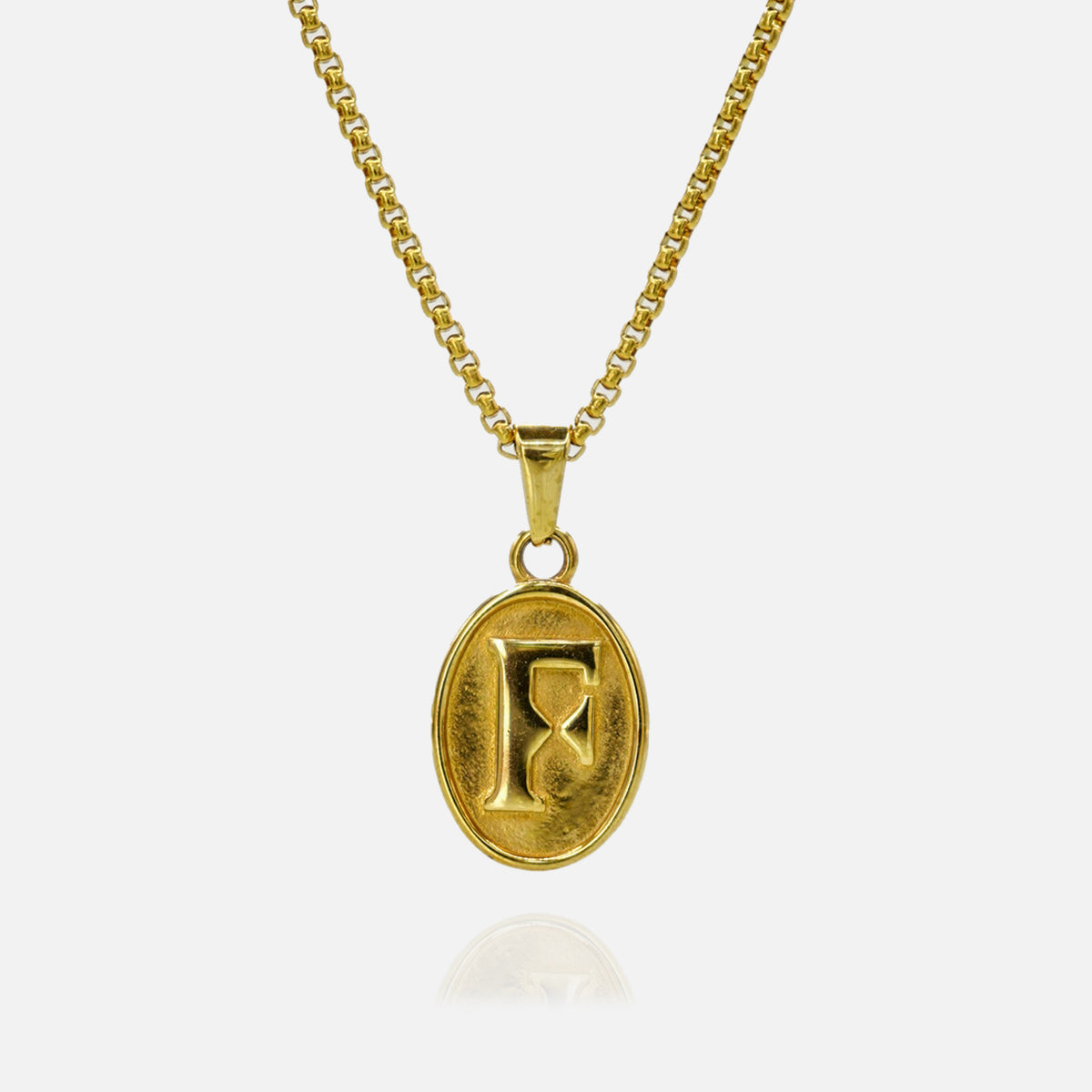 Gold necklace with a pendant featuring the letter 'F' on a white background