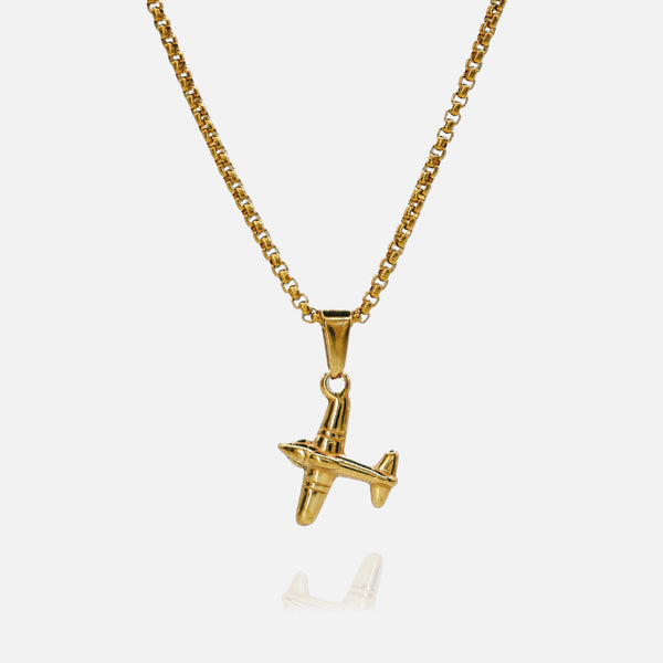 Gold airplane pendant necklace on a white background