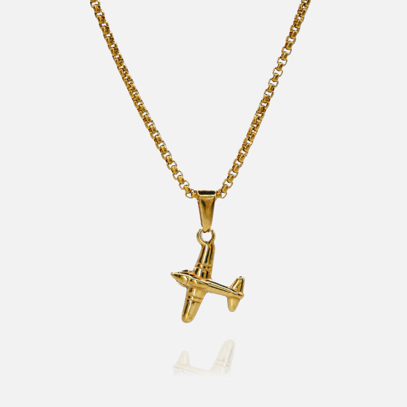 Gold airplane pendant necklace on a white background