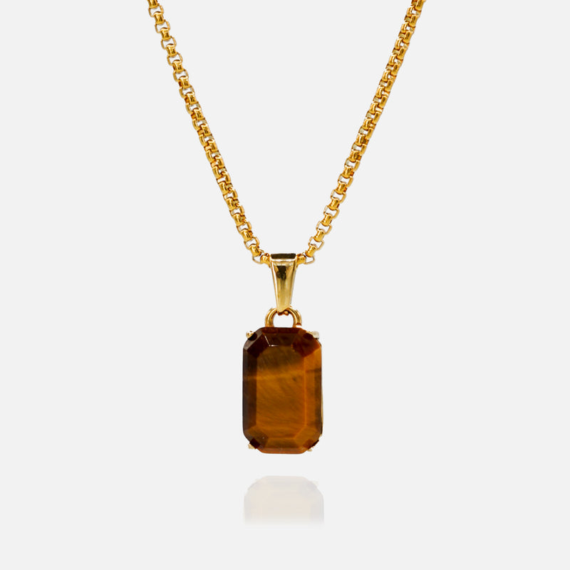 Gold necklace with a rectangular brown gemstone pendant on a white background