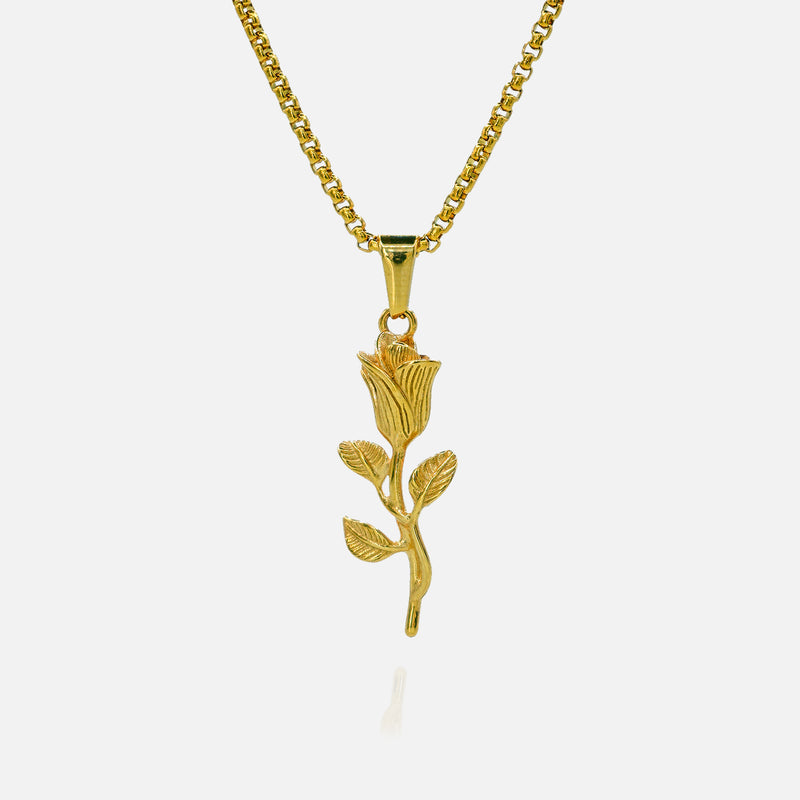 Gold rose-shaped pendant on a chain against a white background