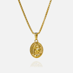 Gold necklace with a circular pendant on a white background
