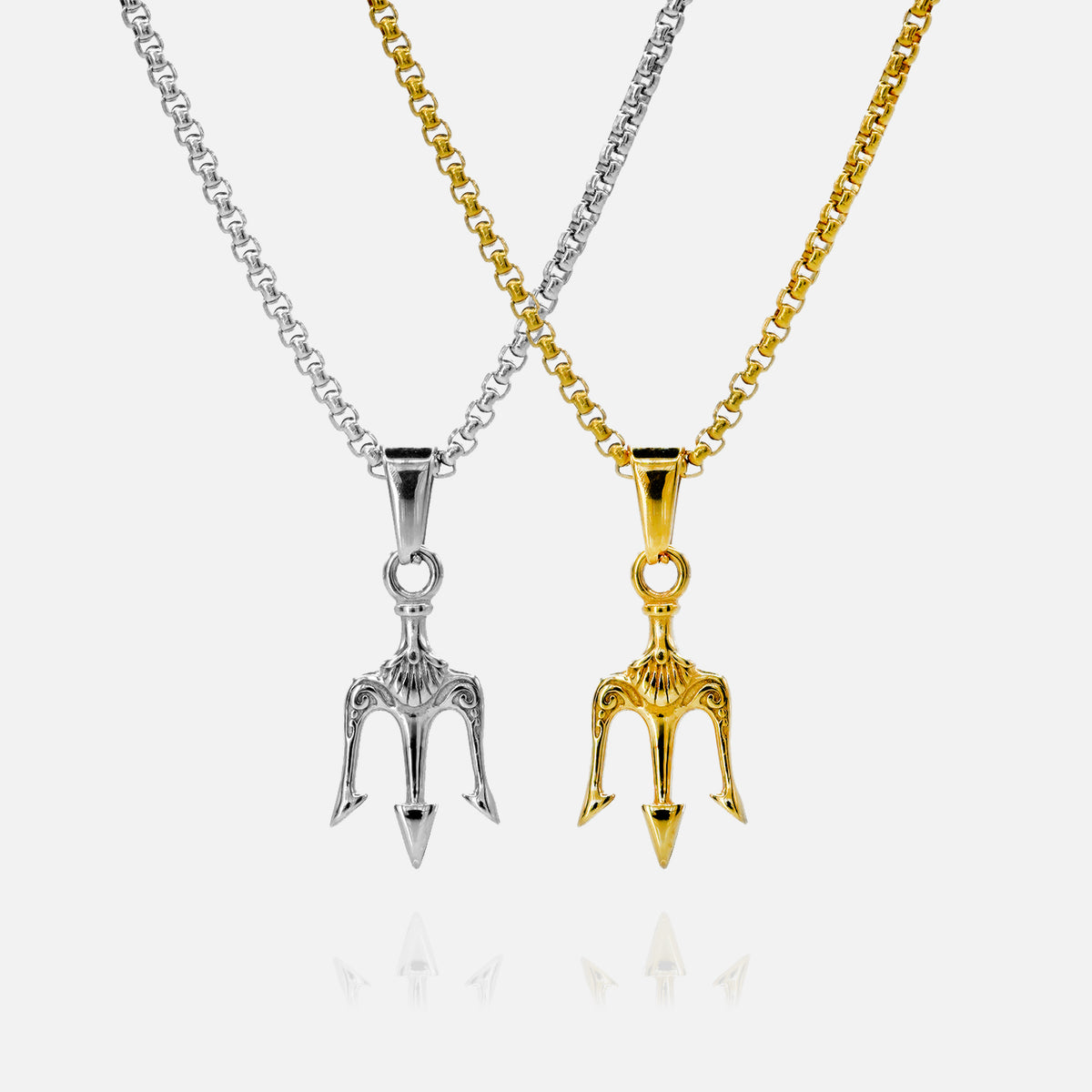 Two necklaces with unique pendants, one silver and one gold, on a white background.