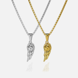 Two angel wing pendants, one silver and one gold, on white backgrounds.