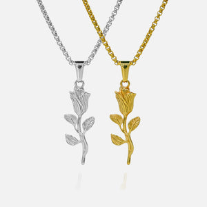 Silver and gold rose-shaped pendants on white background