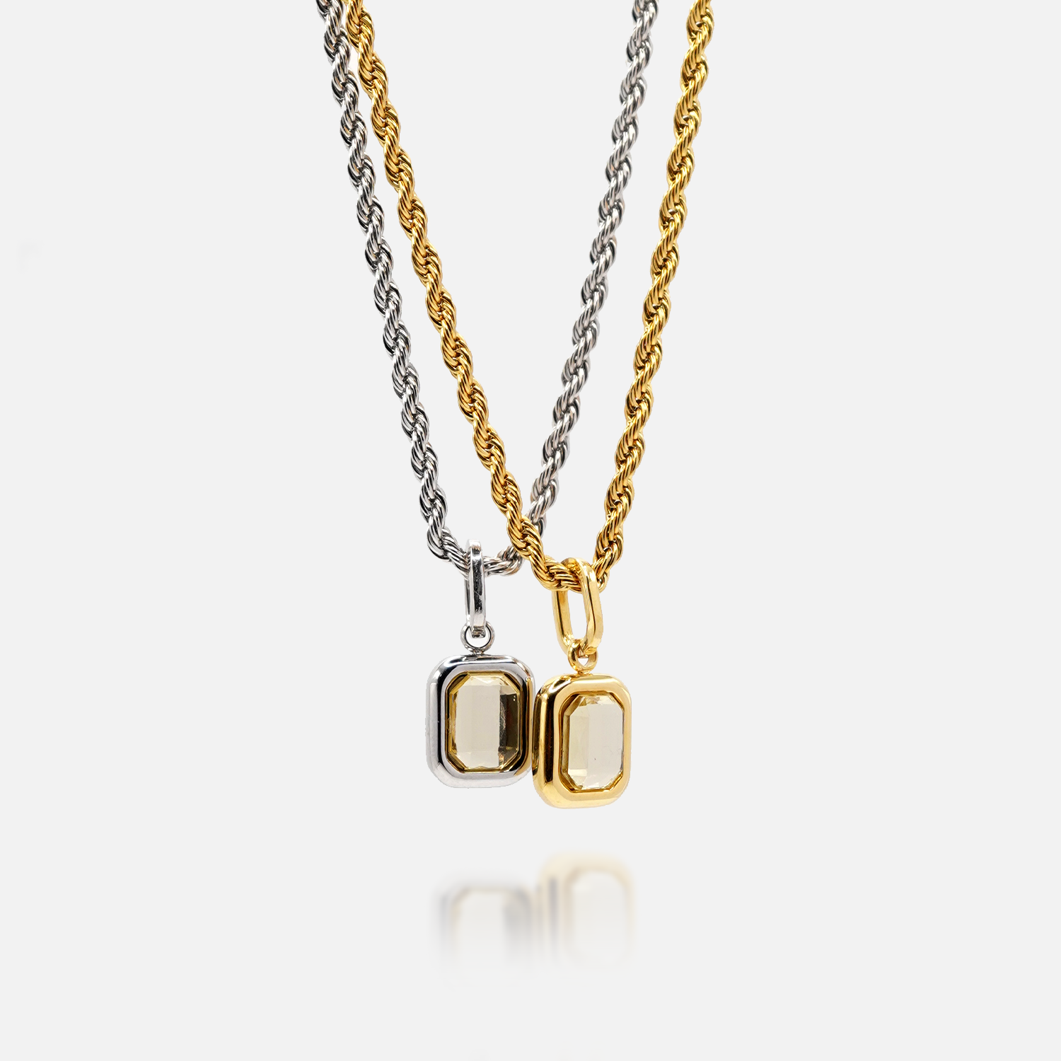 FRNE citrine gemstone pendant necklaces in gold and sterling silver with rectangular yellow stone on white background