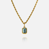FRNE glacier blue gemstone gold pendant necklace featuring a rectangular light blue stone set in a gold frame on a twisted gold chain, isolated on a clean white background