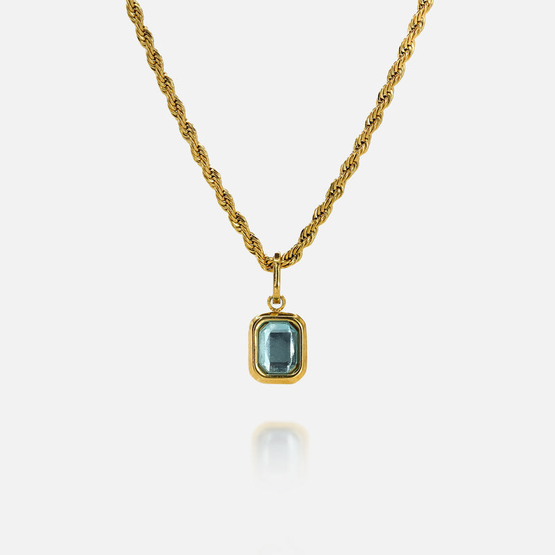 FRNE glacier blue gemstone gold pendant necklace featuring a rectangular light blue stone set in a gold frame on a twisted gold chain, isolated on a clean white background