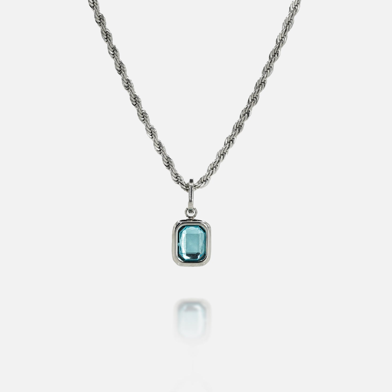 FRNE glacier blue gemstone silver pendant necklace with rectangular light blue stone on a silver chain isolated on a white background