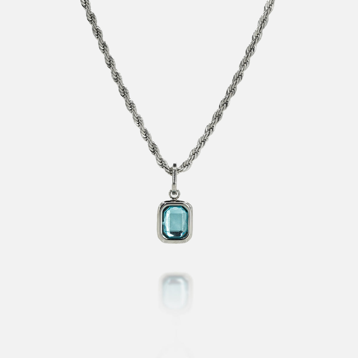 FRNE glacier blue gemstone silver pendant necklace with rectangular light blue stone on a silver chain isolated on a white background