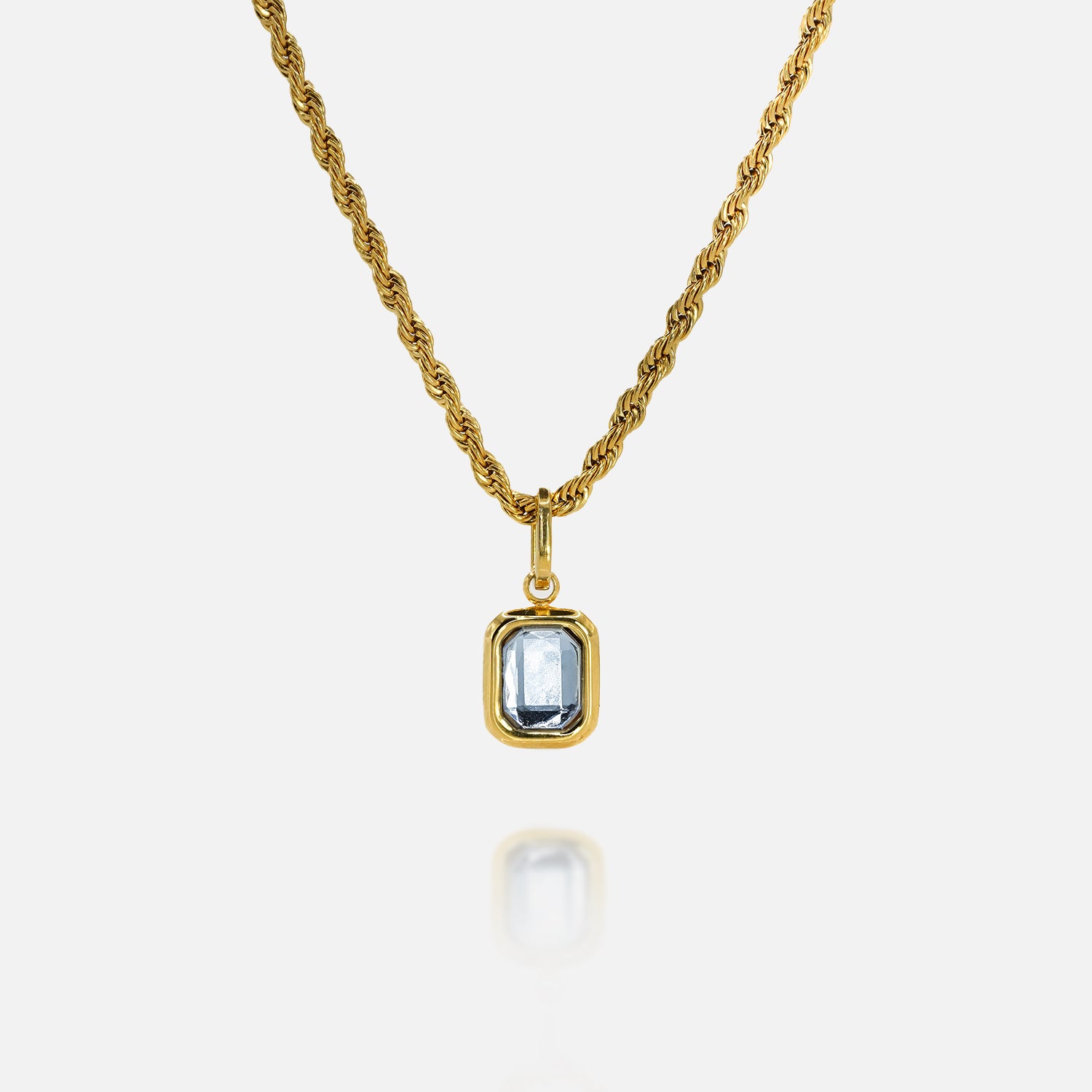 FRNE gold tanzanite pendant necklace with rectangular blue gemstone on white background