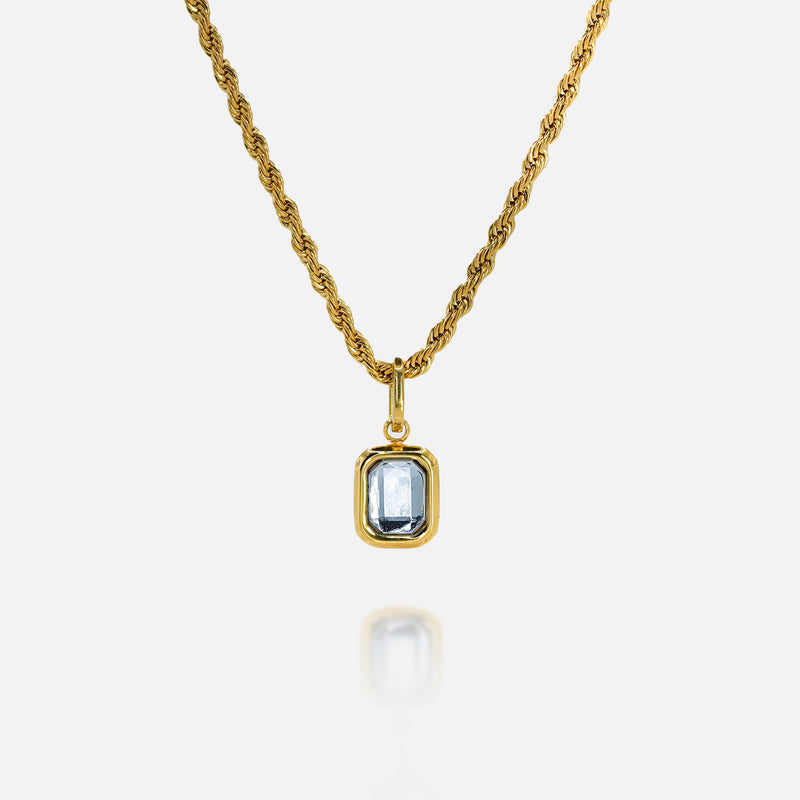 FRNE gold tanzanite pendant necklace with rectangular blue gemstone on white background