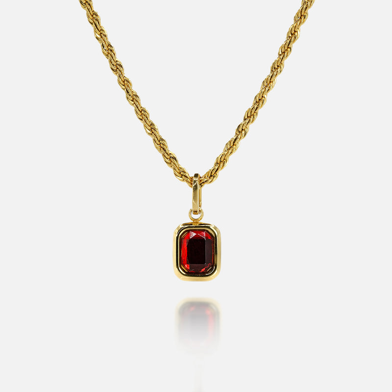 FRNE ruby centre red gemstone gold necklace on a white background, featuring a rectangular deep red stone pendant set in a polished gold frame on a twisted rope-style gold chain