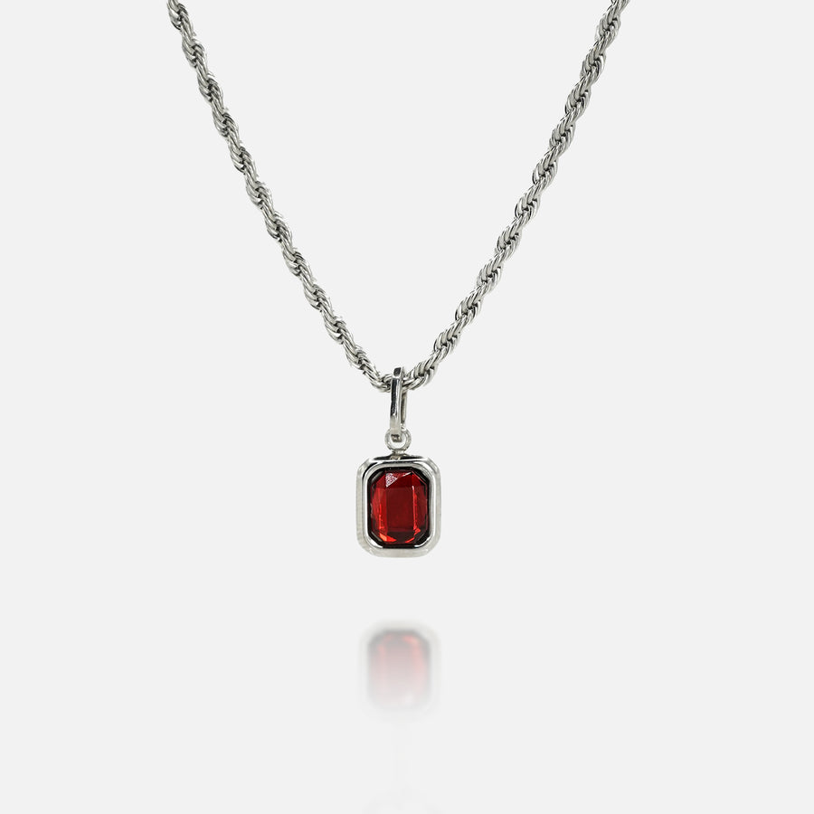 FRNE ruby flame red gemstone silver necklace on a white background, featuring a rectangular deep red stone pendant set in a polished silver frame on a twisted rope-style silver chain