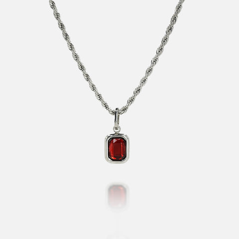 FRNE ruby flame red gemstone silver necklace on a white background, featuring a rectangular deep red stone pendant set in a polished silver frame on a twisted rope-style silver chain